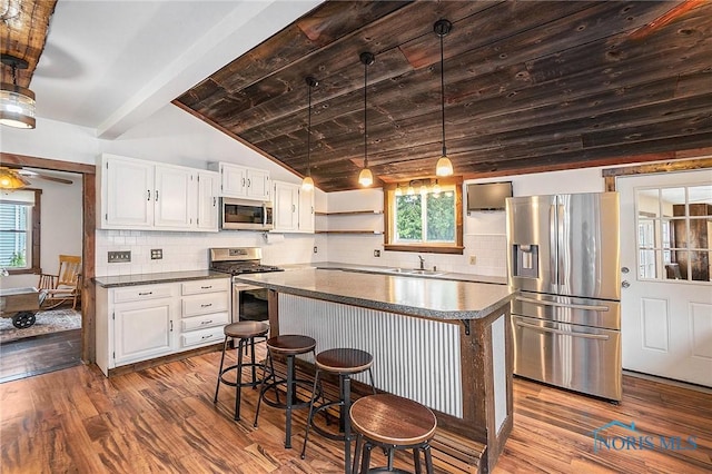 4279 Defiance Pike, Wayne, OH 43466 - kitchen with appliances with stainless steel finishes, dark countertops, dark wood finished floors, a sink, and wooden ceiling