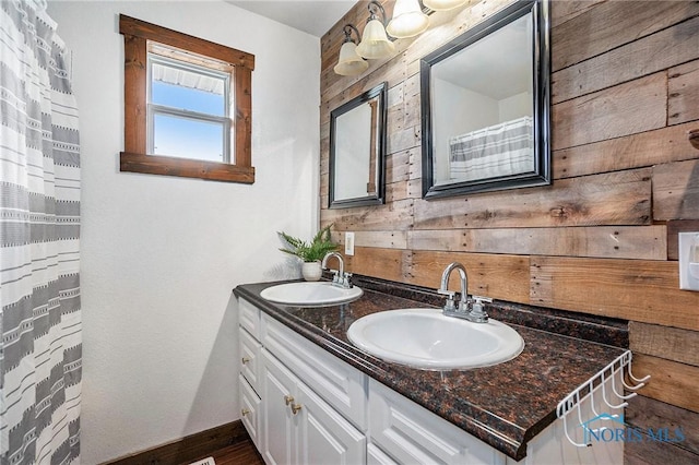 4279 Defiance Pike, Wayne, OH 43466 - full bathroom featuring double vanity, wooden walls, and baseboards
