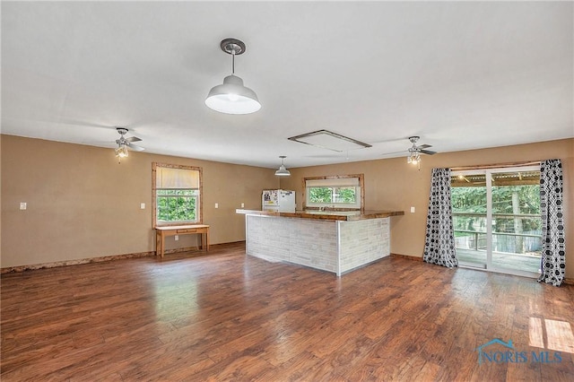 4279 Defiance Pike, Wayne, OH 43466 - unfurnished living room with a ceiling fan, wood finished floors, attic access, and baseboards