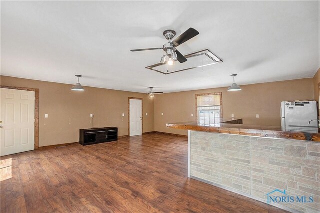 4279 Defiance Pike, Wayne, OH 43466 - unfurnished living room with attic access, ceiling fan, and wood finished floors