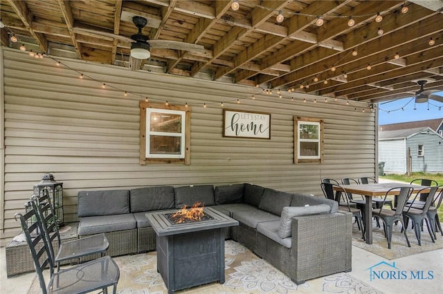 4279 Defiance Pike, Wayne, OH 43466 - view of patio / terrace featuring ceiling fan, an outdoor living space with a fire pit, and outdoor dining area