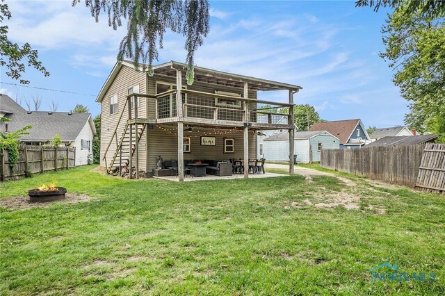 4279 Defiance Pike, Wayne, OH 43466 - back of house featuring an outdoor living space with a fire pit and a patio