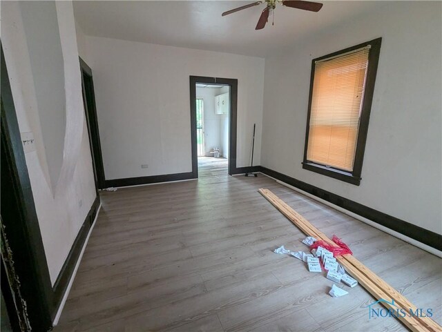 721 N Detroit Ave, Toledo, OH 43607 - empty room featuring wood finished floors, ceiling fan, and baseboards