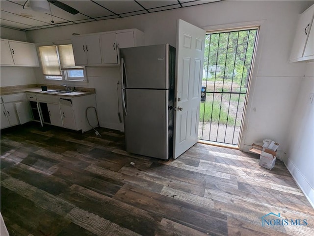 721 N Detroit Ave, Toledo, OH 43607 - kitchen featuring freestanding refrigerator, dark wood finished floors, a sink, and white cabinets