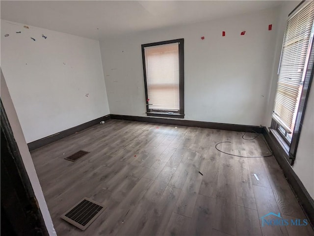 721 N Detroit Ave, Toledo, OH 43607 - spare room featuring wood finished floors and baseboards