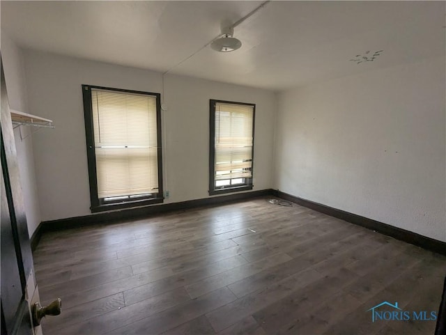 721 N Detroit Ave, Toledo, OH 43607 - empty room featuring baseboards and wood finished floors