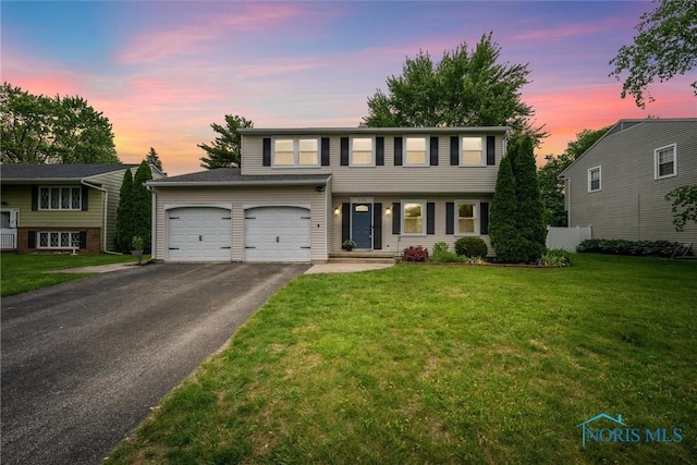 119 Mallard Rd, Perrysburg, OH 43551 - view of front of property featuring asphalt driveway and a front yard