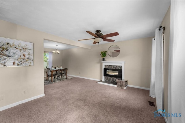 119 Mallard Rd, Perrysburg, OH 43551 - carpeted living room featuring a glass covered fireplace, baseboards, ceiling fan, and a chandelier
