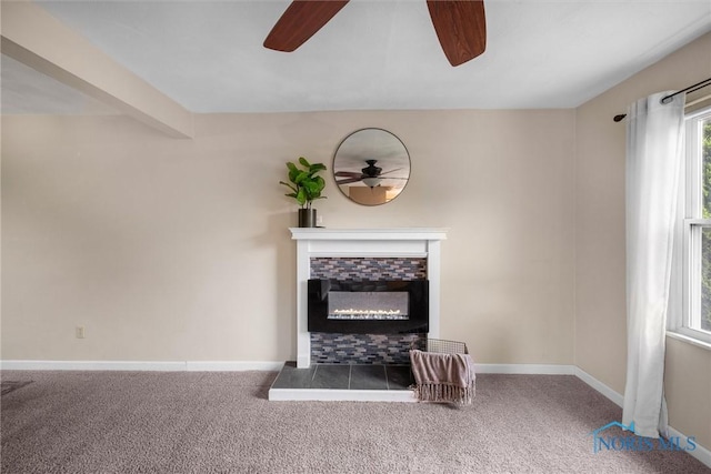119 Mallard Rd, Perrysburg, OH 43551 - unfurnished living room with ceiling fan, a glass covered fireplace, carpet floors, and baseboards