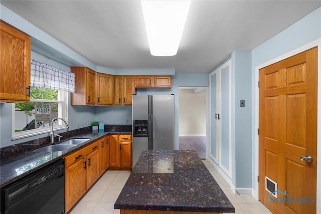 119 Mallard Rd, Perrysburg, OH 43551 - kitchen with black dishwasher, stainless steel fridge, a sink, and brown cabinetry