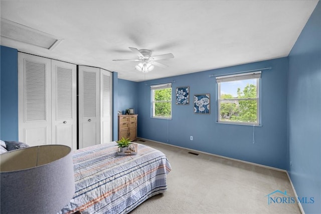 119 Mallard Rd, Perrysburg, OH 43551 - carpeted bedroom with a closet, baseboards, attic access, and a ceiling fan