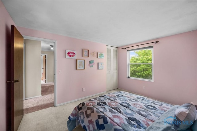 119 Mallard Rd, Perrysburg, OH 43551 - carpeted bedroom featuring a closet and baseboards