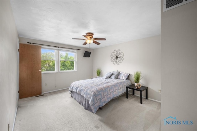 119 Mallard Rd, Perrysburg, OH 43551 - carpeted bedroom with baseboards and a ceiling fan
