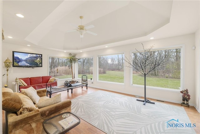 8801 W Bancroft St, Toledo, OH 43617 - living room with recessed lighting, light wood finished floors, a ceiling fan, baseboards, and a raised ceiling