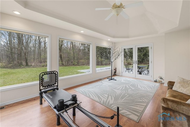 8801 W Bancroft St, Toledo, OH 43617 - exercise area with french doors, a tray ceiling, a ceiling fan, recessed lighting, and baseboards