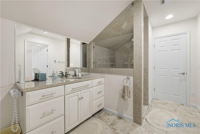 8801 W Bancroft St, Toledo, OH 43617 - bathroom featuring vanity, vaulted ceiling, and walk in shower