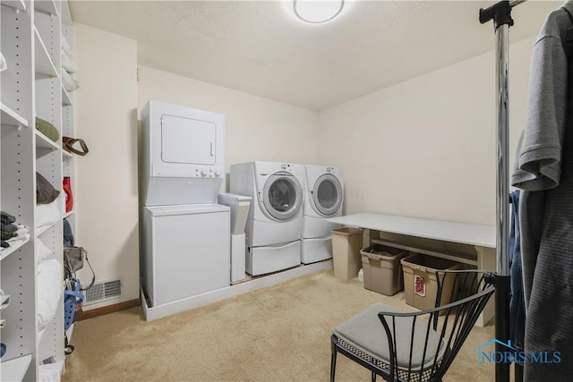 8801 W Bancroft St, Toledo, OH 43617 - laundry area featuring light colored carpet, estacked washer and dryer, and washing machine and clothes dryer