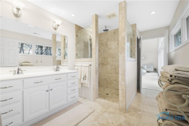 8801 W Bancroft St, Toledo, OH 43617 - bathroom featuring ensuite bath, walk in shower, double vanity, recessed lighting, and baseboards