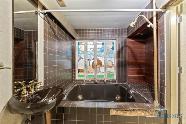 1250 Hidden Ridge Rd, Toledo, OH 43615 - full bathroom with a tub with jets and a sink