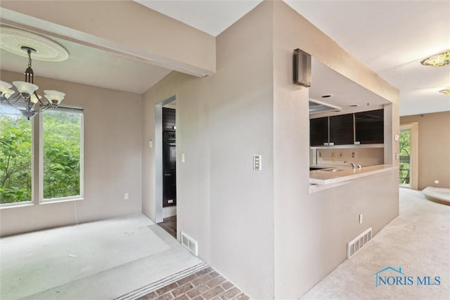 1250 Hidden Ridge Rd, Toledo, OH 43615 - view of exterior entry with a patio area and an outdoor kitchen
