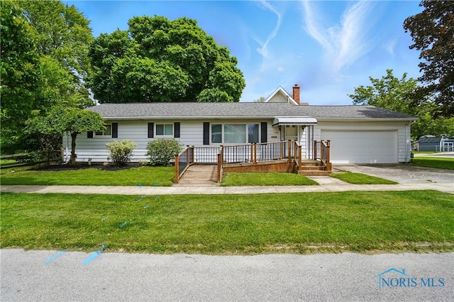 1306 N Union St, Fostoria, OH 44830 - ranch-style home with a garage, a chimney, a front lawn, and driveway
