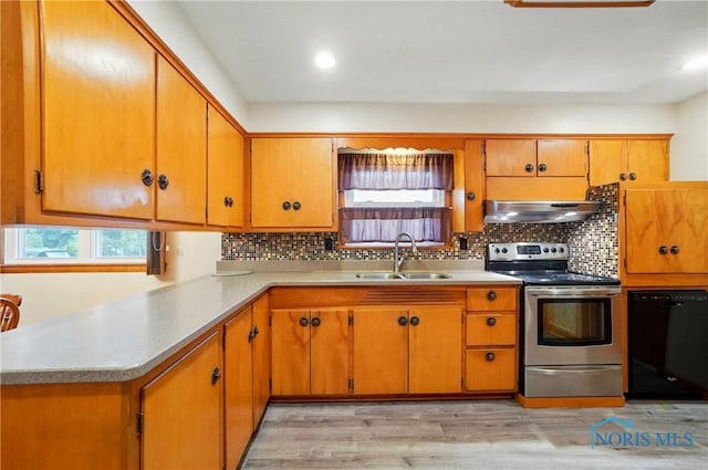 1306 N Union St, Fostoria, OH 44830 - kitchen featuring a sink, stainless steel electric stove, black dishwasher, under cabinet range hood, and light wood-type flooring