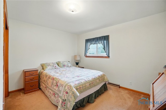 1306 N Union St, Fostoria, OH 44830 - bedroom with light carpet, baseboards, and baseboard heating