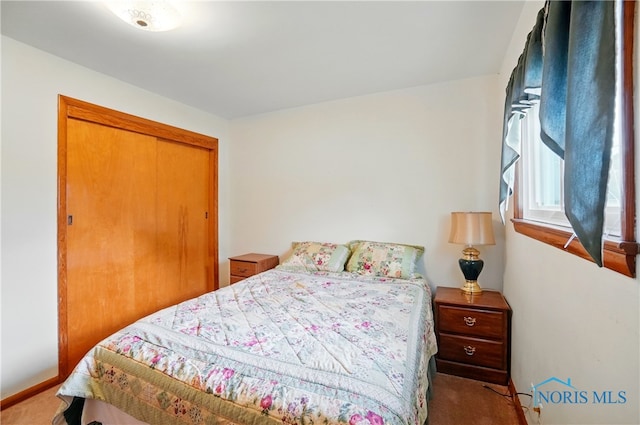 1306 N Union St, Fostoria, OH 44830 - bedroom featuring carpet flooring, baseboards, and a closet