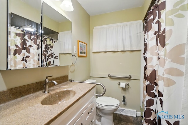 1306 N Union St, Fostoria, OH 44830 - bathroom featuring vanity, toilet, and a shower with shower curtain