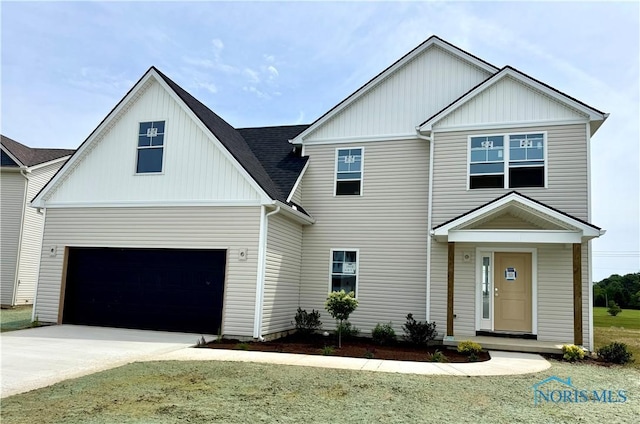 1912 Caleb Ct, Waterville, OH 43566 - view of front of home featuring driveway and board and batten siding