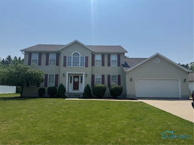 640 Hemlock St, Wauseon, OH 43567 - colonial house with a garage, driveway, and a shingled roof