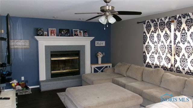 640 Hemlock St, Wauseon, OH 43567 - living room featuring ceiling fan, wood finished floors, and a glass covered fireplace