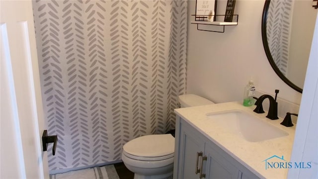640 Hemlock St, Wauseon, OH 43567 - bathroom featuring toilet and vanity