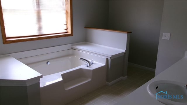 640 Hemlock St, Wauseon, OH 43567 - bathroom featuring a bath and tile patterned flooring
