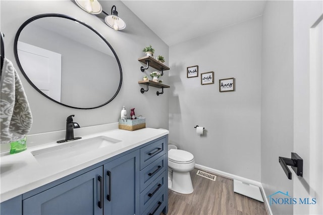640 Hemlock St, Wauseon, OH 43567 - bathroom featuring vanity and wood finished floors