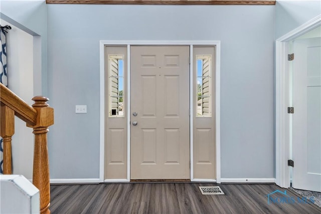 640 Hemlock St, Wauseon, OH 43567 - entryway with dark wood-style flooring and stairway