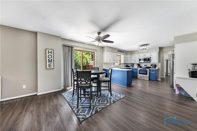 640 Hemlock St, Wauseon, OH 43567 - dining space with dark wood finished floors and ceiling fan