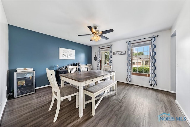 640 Hemlock St, Wauseon, OH 43567 - dining area featuring wood finished floors, beverage cooler, ceiling fan, and an office area