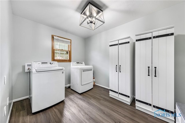 640 Hemlock St, Wauseon, OH 43567 - laundry room featuring washing machine and dryer, dark wood-type flooring, and a chandelier