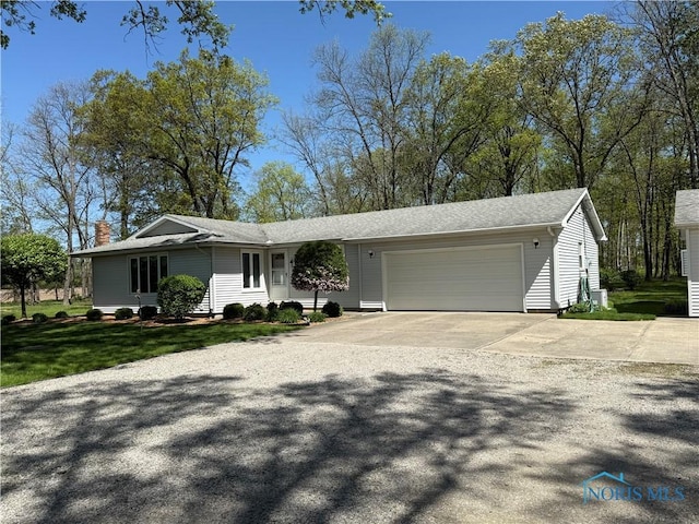 20642 Buckskin Rd, Defiance, OH 43512 - view of front of home featuring an attached garage, driveway, a chimney, and a front yard