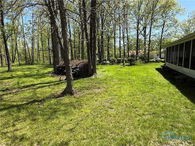 20642 Buckskin Rd, Defiance, OH 43512 - view of green lawn with a sunroom