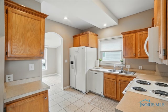 404 W Yates Ave, Findlay, OH 45840 - kitchen with white appliances, a sink, light countertops, healthy amount of natural light, and recessed lighting