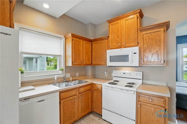 404 W Yates Ave, Findlay, OH 45840 - kitchen with white appliances, a sink, plenty of natural light, and light countertops