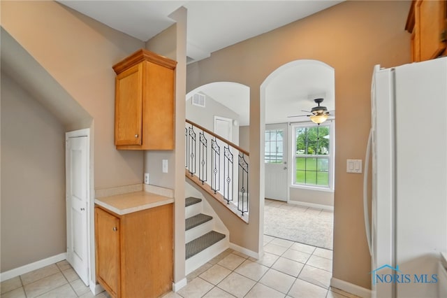 404 W Yates Ave, Findlay, OH 45840 - staircase with tile patterned floors, a ceiling fan, and baseboards