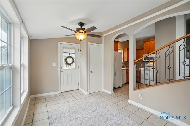 404 W Yates Ave, Findlay, OH 45840 - foyer entrance with ceiling fan, light tile patterned flooring, baseboards, and arched walkways