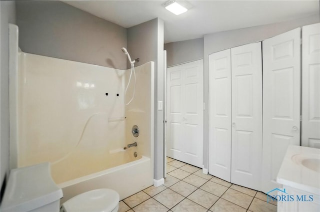 404 W Yates Ave, Findlay, OH 45840 - bathroom with a closet, tile patterned floors, washtub / shower combination, toilet, and vanity