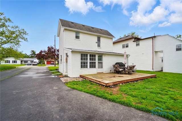 404 W Yates Ave, Findlay, OH 45840 - rear view of property featuring a deck and a lawn