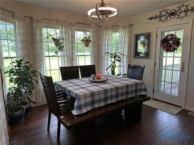 20515 Lockwood Rd, Defiance, OH 43512 - dining area featuring dark wood-style floors, a chandelier, and baseboards