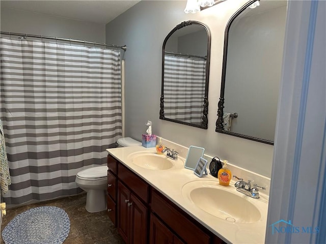 20515 Lockwood Rd, Defiance, OH 43512 - full bathroom featuring toilet, double vanity, and a shower with shower curtain