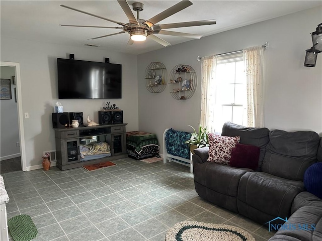 20515 Lockwood Rd, Defiance, OH 43512 - living area featuring a ceiling fan, tile patterned flooring, and baseboards